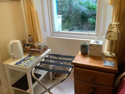 a room with a desk and a chair and a window at Struan House B&B in Tarbert