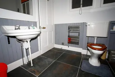 a bathroom with a sink and a toilet at Royal Bank Flat in Oban