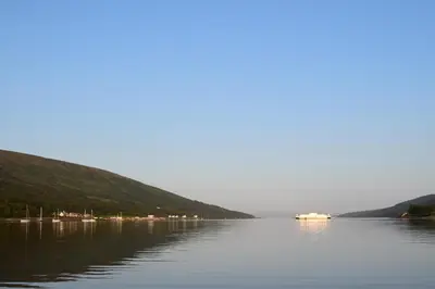 a boat on a large body of water at The Colintraive in Colintraive