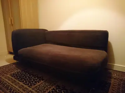 a brown couch sitting in a living room at Central and Convenient in Edinburgh