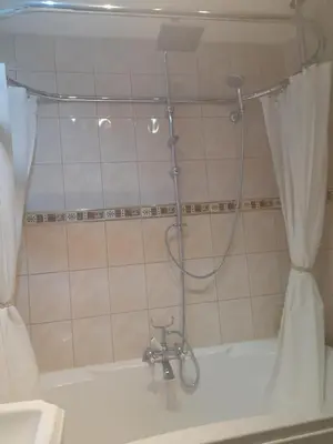 a shower in a bathroom with a shower curtain at Montague Villa in Dunoon