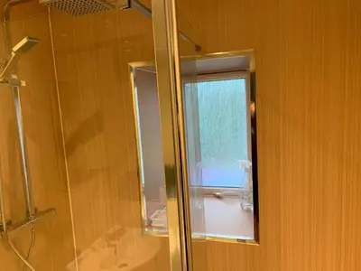 a bathroom with a shower and a glass window at 105 Nelson Street in Largs