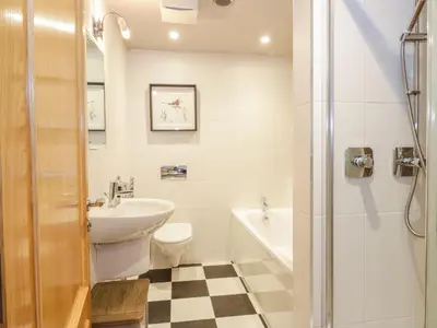 a bathroom with a sink toilet and a shower at Duplex in Moffat