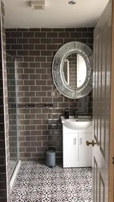 a bathroom with a sink and a mirror at Fasgadh Rooms in Tarbert