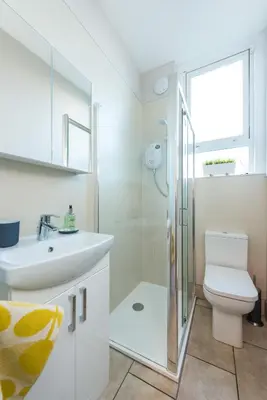 a bathroom with a toilet and a sink and a shower at The Westfield in Edinburgh