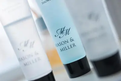 a group of three bottles of cosmetics on a counter at The Westfield in Edinburgh