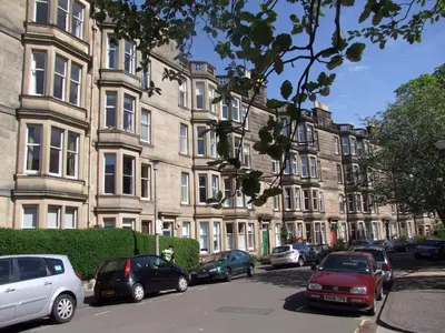a row of cars parked in front of a building at Mardale Crescent - 380 in Edinburgh