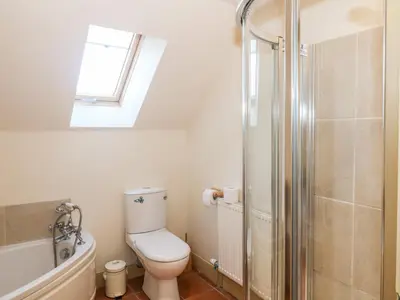 a bathroom with a toilet and a shower at The Roundhouse in Auchterarder