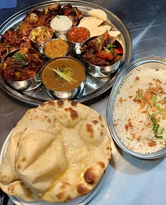 a table with three trays of different types of food at Glendevon Hotel in Auchterarder