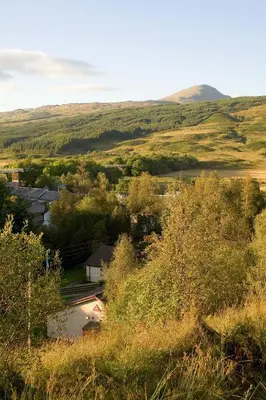 a view of a small town in the hills at Crianlarich Youth Hostel in Crianlarich
