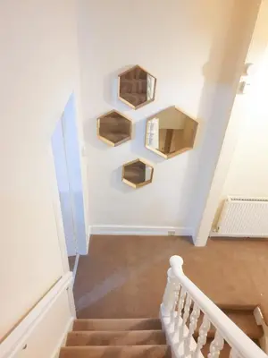 a stairway with wooden boxes on the wall at Oaktree Appartment Moffat in Moffat