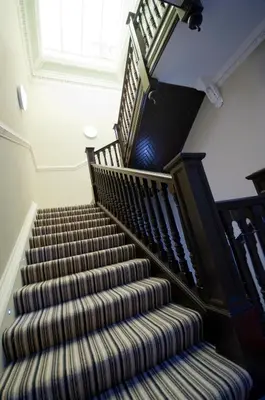 an image of a staircase in a house at Palmerston Suites in Edinburgh
