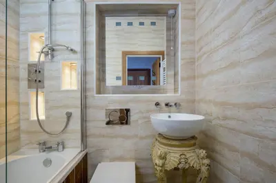 a bathroom with a sink and a toilet and a shower at Castle Vista, Grassmarket Apartment in Edinburgh