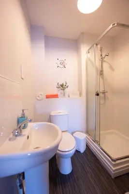 a bathroom with a sink and a toilet and a shower at PREMIER - Wishaw En-Suite Apartment in Wishaw