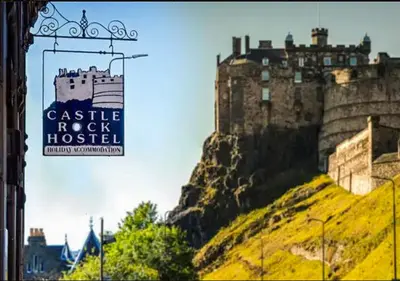 a castle rock hospital sign in front of a castle at Castle Rock Hostel - Adults Only in Edinburgh
