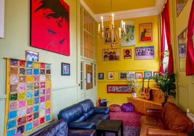 a living room with a couch and a table at Castle Rock Hostel - Adults Only in Edinburgh