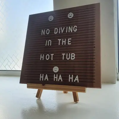 a sign that says no driving in the hot tub at The Sleeping Dog Room at The Grumpy Schnauzer BnB Huge Room, Luxe Suite, Private Hot Tub, Breakfast, Gym, Games Room, Farm Stay, Amazing in Airdrie