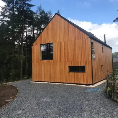 Red Stag with stunning loch and waterfall view