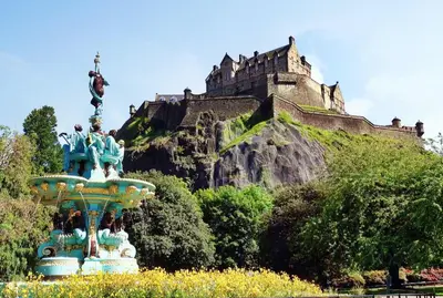 a statue in front of a castle on a hill at Stylish & Charming Retreat for 2- City Centre! - Pass the Keys in Edinburgh