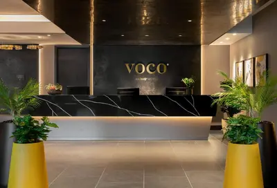 a lobby with a yoga counter with potted plants at voco Edinburgh - Haymarket by IHG in Edinburgh