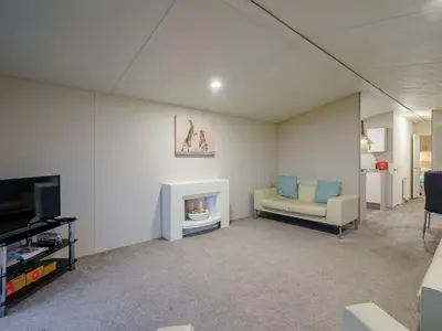 a living room with a couch and a fireplace at The Paddocks - Uk7112 in Alloa