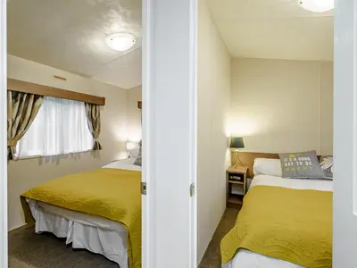 a bedroom with two beds and a window at The Orchard - Uk7111 in Alloa