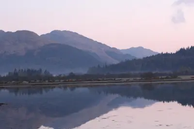 a large body of water with mountains in the background at Clyde View B&B in Dunoon