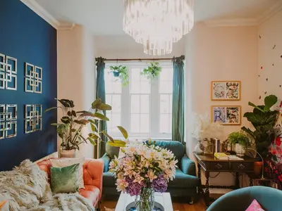 a living room with a couch and a vase of flowers at Wild Geese Lodge - Uk31046 in Portpatrick