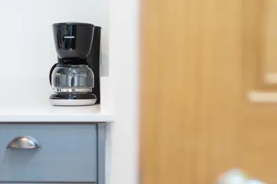a coffee maker sitting on top of a counter at City Centre, Newly Refurbished Stylish Apartment in Edinburgh