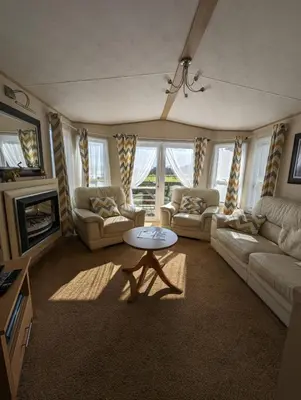a living room with couches and a coffee table at The Ashcroft Sea View 6 in Dunoon