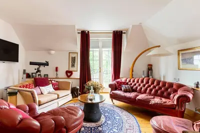 a living room with two couches and a table at Luxury Duplex - Sleeps 2 - Hot Tub - Parking in Glenfarg