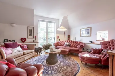 a living room with couches and a table at Luxury Duplex - Sleeps 2 - Hot Tub - Parking in Glenfarg
