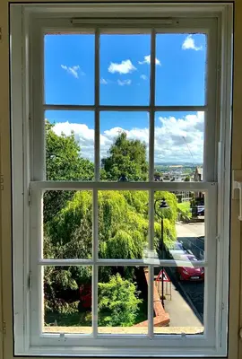 a window with a view of a street at Old Spittal Hospital Apartment - Free Parking in Stirling