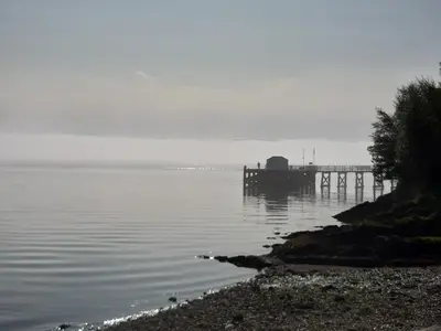 a dock on a body of water with a pier at Off Grid 1-Bed Cabin Pets Ok 20 mins to Dunoon in Blairmore