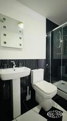 a bathroom with a white toilet and a sink at Royal Marine Hotel Dunoon in Kirn