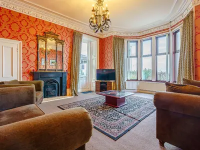 a living room with a couch and a fireplace at The Old Nunnery - Uk7122 in Skelmorlie