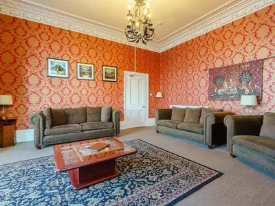 a living room with two couches and a table at The Old Nunnery - Uk7122 in Skelmorlie
