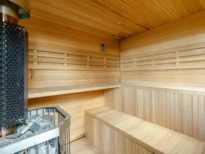an empty sauna with wooden walls and wooden floors at The Old Nunnery - Uk7122 in Skelmorlie