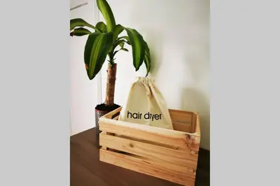 a plant in a wooden box with a bag at 2 Calgow Cottages in Newton Stewart