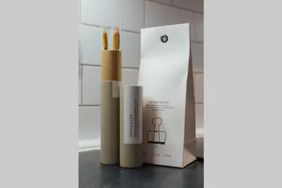 a set of three bamboo candles next to a box at Glasgow Central Luxury Apartment in Glasgow