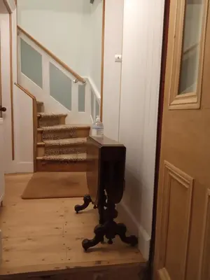 a television sitting in the middle of a hallway at Kirkview House in Moffat