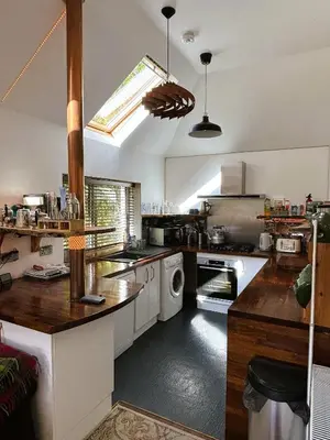 a kitchen with a sink and a stove top oven at North Lodge Kilmun in Kilmun