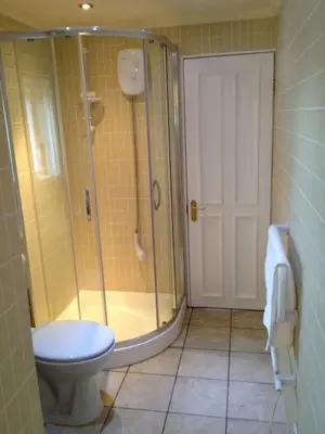a bathroom with a shower and a toilet at Upper Imeraval Cottage Sleeps 6 Pet-Friendly in Port Ellen