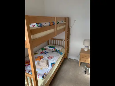 a bedroom with two bunk beds in a room at Eilean View in Lamlash