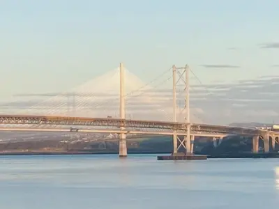 a large white bridge over the water at Forth Reflections in Queensferry