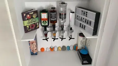 a refrigerator with a bunch of items in it at The Clachan Flat in Rosneath