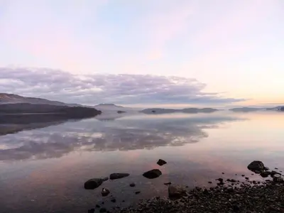 a large body of water with clouds in the sky at Ellanderroch in Glasgow