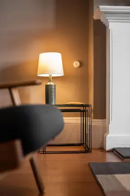 a lamp sitting on a table in a room at 16 1 Eildon Street in Edinburgh