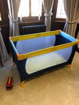 a blue and yellow bed in a room with a toy truck at Beautiful 4-Bed Villa in Glasgow in Glasgow
