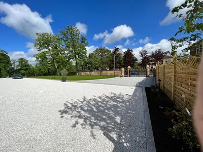 a shadow of a tree on a driveway at Beautiful 4-Bed Villa in Glasgow in Glasgow